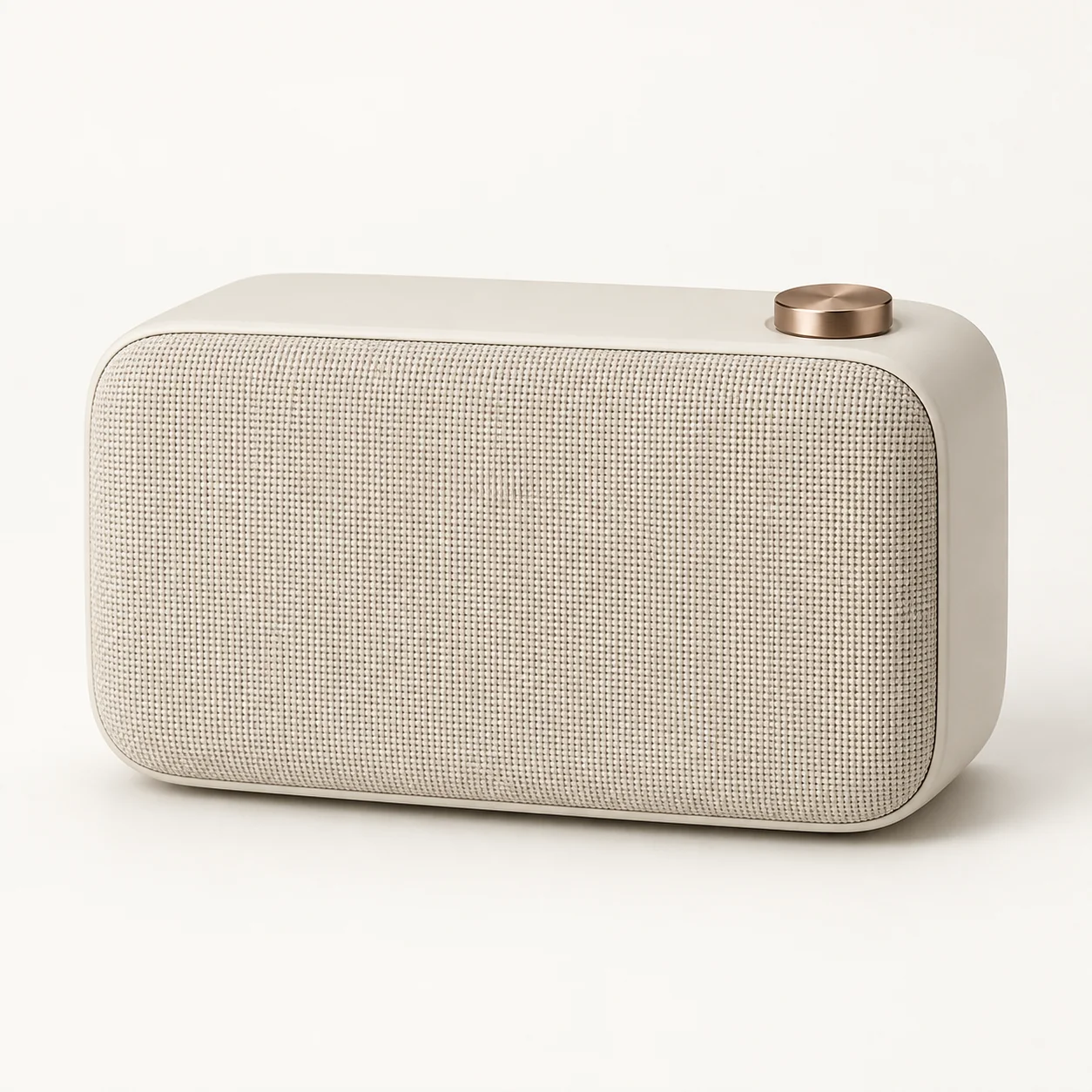 Ivory portable speaker with a copper knob on a neutral background